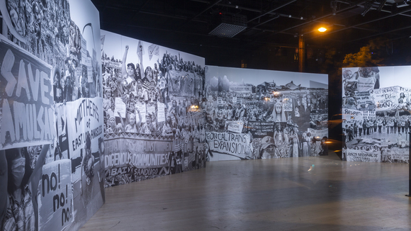 A mural of black and white photos from various social justice protests