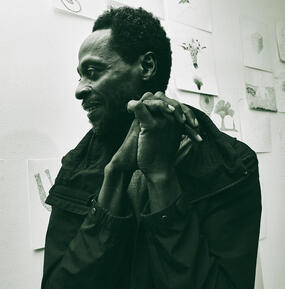 medium black & white portrait of Mario Lewis