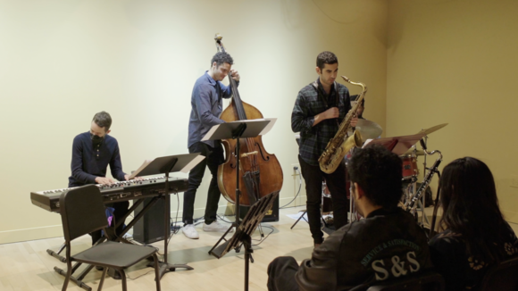 Ensemble of a saxophonist, bassist, drummer, and pianist perform