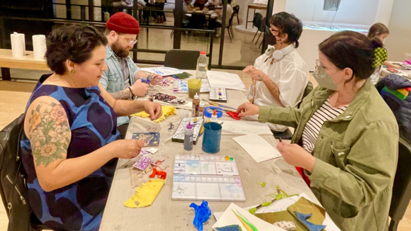 People make art together at a table