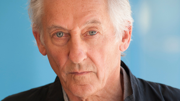 medium color portrait of Ed Ruscha wearing a button up shirt & jacket, looking directly to camera