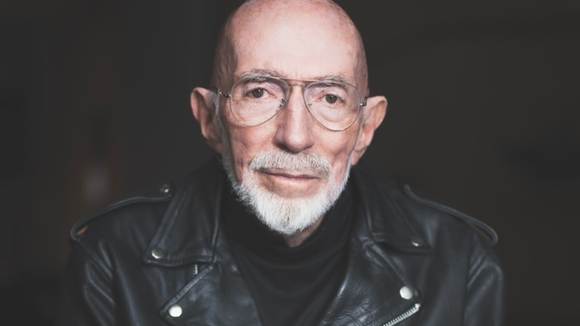 medium color portrait of Kip Thorne wearing a black leather motorcycle jacket and glasses, looking directly to camera