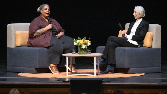 color photo of Roxane Gay and Alexandra Grant in conversation on stage