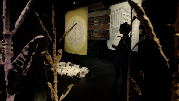 color silhouette of Tiffany Barber in the gallery, with foreground elements