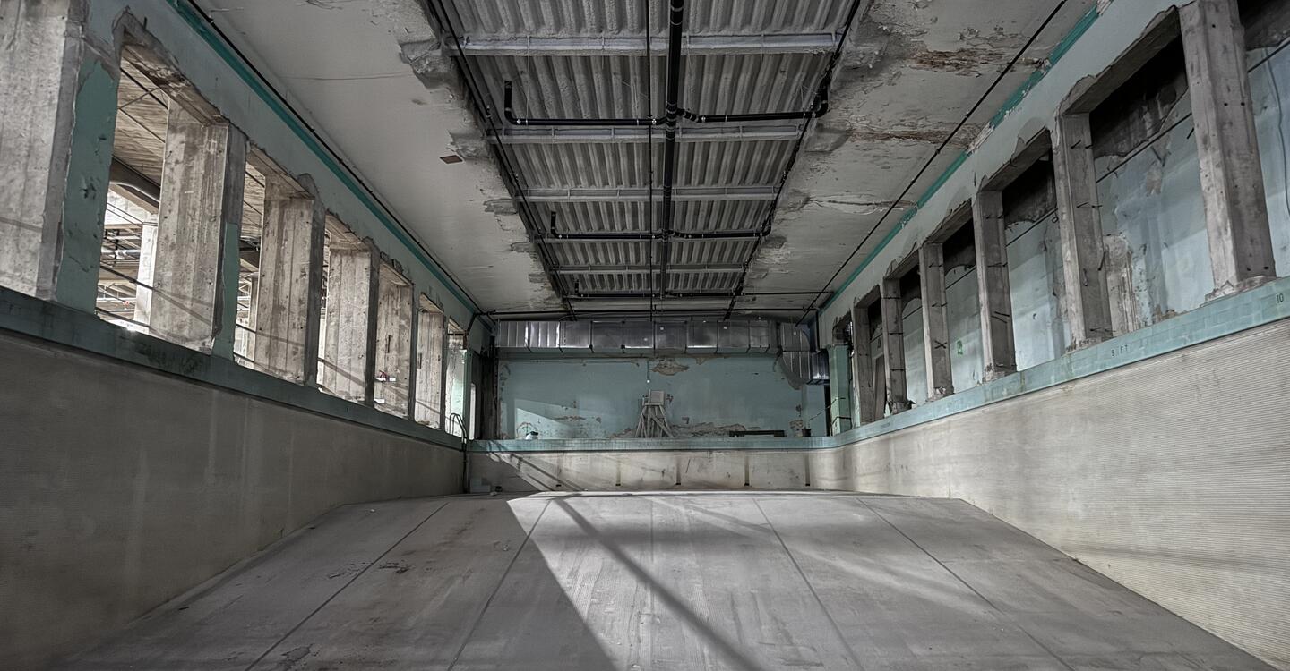 full color wide shot of an empty underground pool