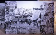 A mural of black and white photographs from protests for social justice