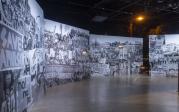 A mural of black and white photographs from protests for social justice