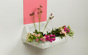 Wall mounted sink with flowers underneath a large pink rectangle, work titled "Vase with flowers"