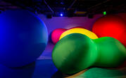 Vibrantly colored large inflatables of varying shapes and sizes. 