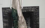 mannequin wearing sparkly silver and green dress