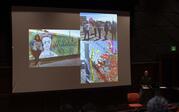 Betty Avila presenting photos of artwork