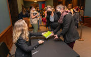 Rebecca Solnit signing book with audience member
