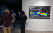 Gallery view of "DukeMTMC Datageist" on right with crowd of people on the left.