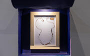 Image of one of four of the amulet photographs, "Amulet necklace believed to render the wearer invisible, Thailand."