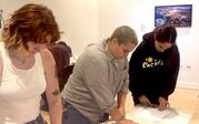 People printmaking with linoleum. 