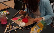People making art with clay and watercolor