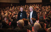 Paul Holdengraber and Ed Ruscha walk through the audience