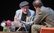 medium shot of Kip Thorne talking to Paul Holdengraber on stage