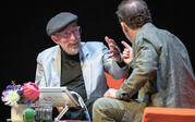 medium shot Kip Thorne talking to Paul Holdengraber on stage