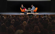 over audience wide shot Miranda July and Paul Holdengraber on stage