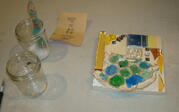Mosaic and jars on a table. 