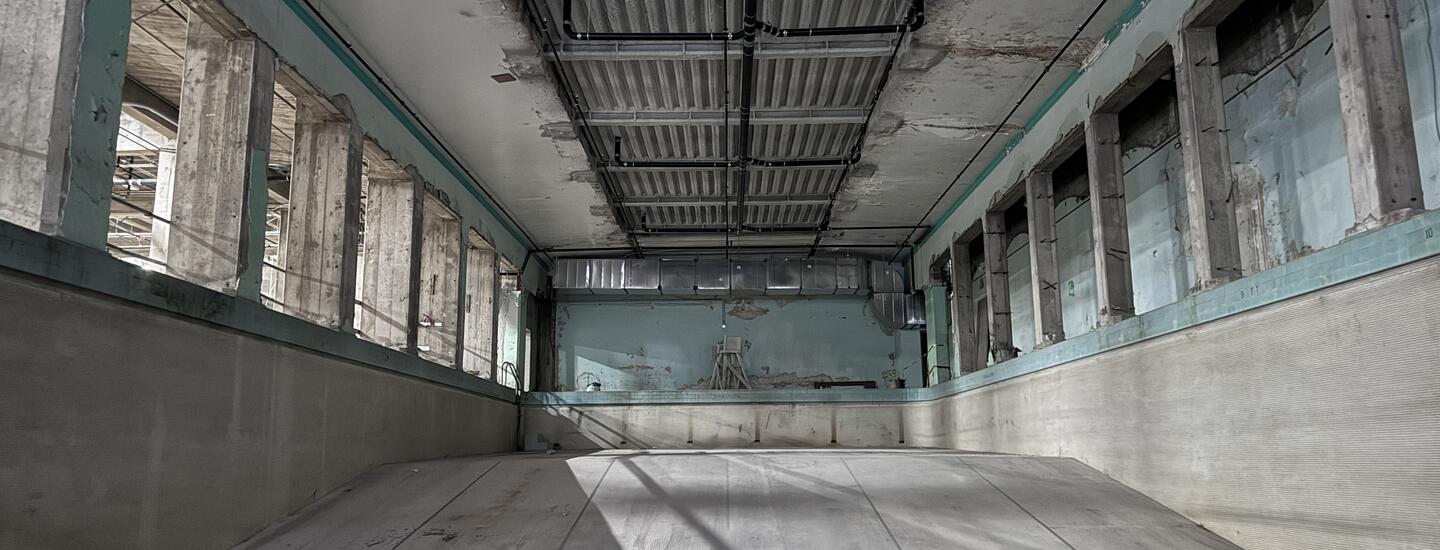 full color wide shot of an empty underground pool