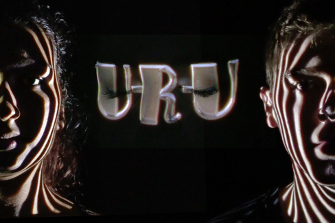 projection on peoples of faces of the letters U-R-U