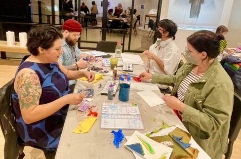 People make art together at a table