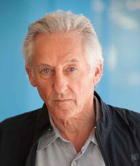 medium color portrait of Ed Ruscha wearing a button up shirt & jacket, looking directly to camera