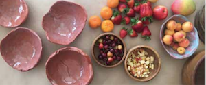 Bowls full of food are displayed