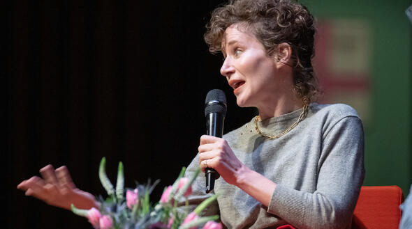 profile medium image of Miranda July speaking to an audience
